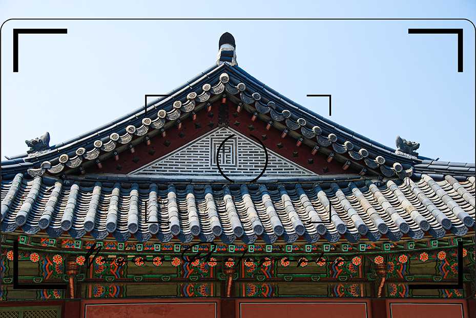 looking at a roof of one of the buildings at Gyeongbokgung in Seoul, south korea