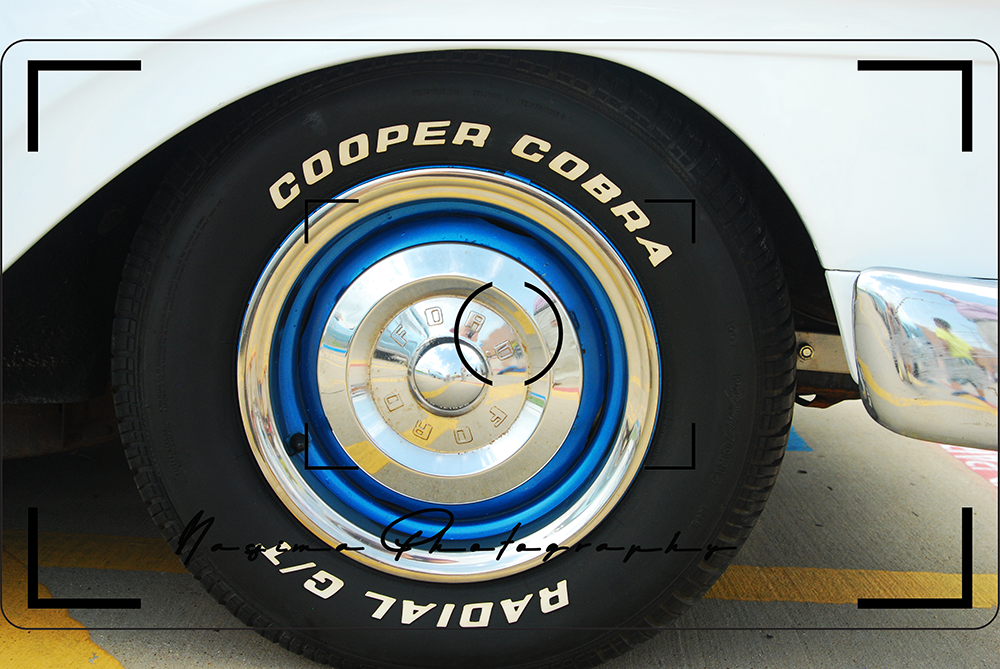 cooper cobra radial g/t tire with white and blue on a Ford 