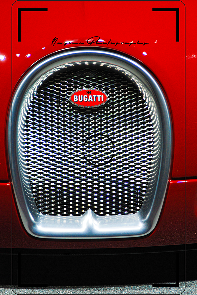closeup of a grill on a red bugatti at Frankfurt IAA in 2011