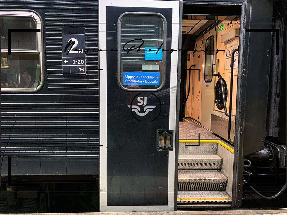 open door of a black train in Stockholm main station going from Uppsala to Stockholm and back