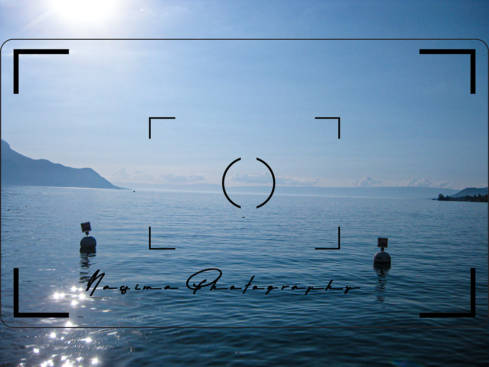 view on Lake Geneva standing in front of the Freddie Mercury statue