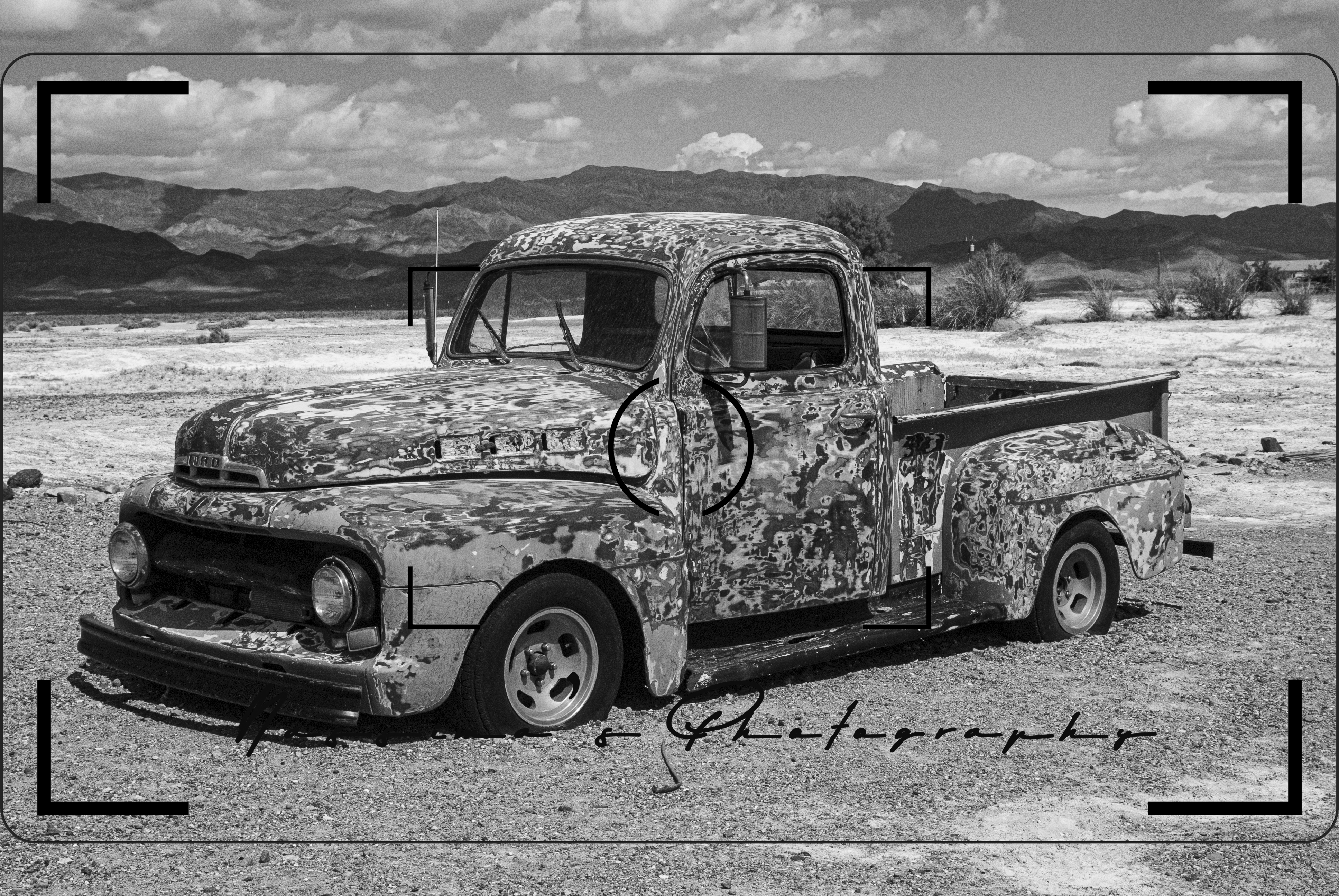 orange rusted truck in the Mojave Desert at Tecopa Hot Springs